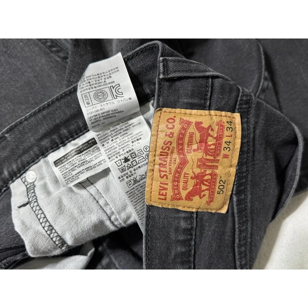 Levis 502 Jeans Mens 34x30 Black Regular Tapered Mid Rise Dark‎ Wash Denim